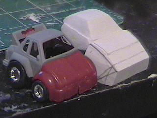 These are the first clay parts I sculpted next to the Cliffjumper I used to make the first kitbash. 